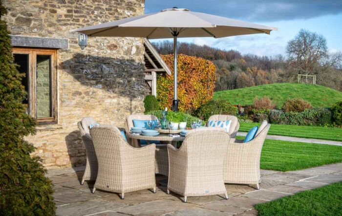 Bramblecrest Monterey 6 Seater Round Sandstone Dining Set - Includes Lazy Susan Parasol & Base